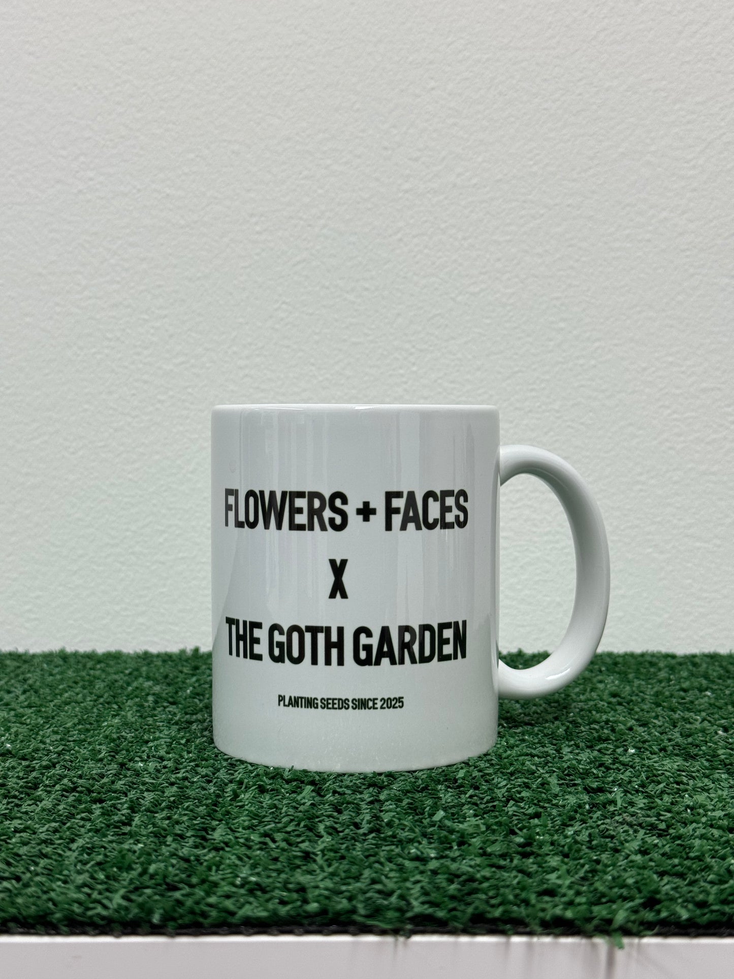 flowers + faces x the g0th garden black mamba begonia coffee mug