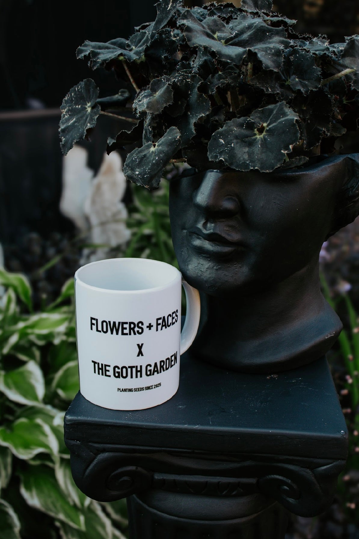 flowers + faces x the g0th garden black mamba begonia coffee mug